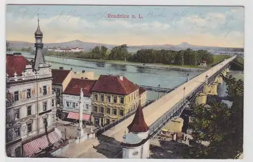 99528 Ak  Roudnice nad Labem (Raudnitz) - Stadtansicht mit Geschäften 1915