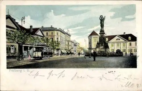 Ak Freiburg im Breisgau, Siegesdenkmal, Straßenbahn