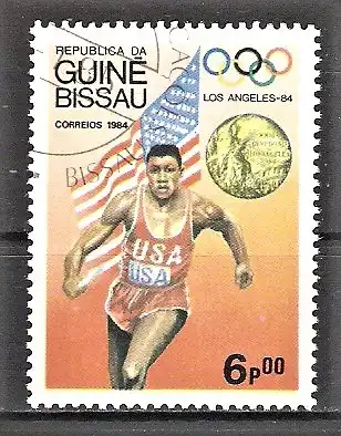 Briefmarke Guinea-Bissau Mi.Nr. 818 o Medaillengewinner Olympiade Los Angeles 1984 / Leichtathlet Carl Lewis