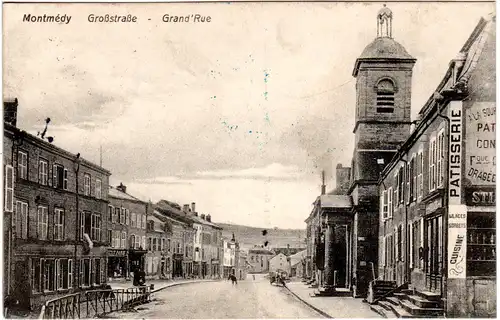 Frankreich, MONTMÉDY Großstr. m. Geschäften, 1915 gebr. sw-AK