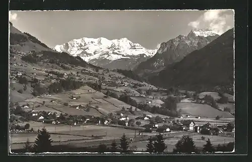 Foto-AK Emanuel Gyger: Reichenbach, Ortsansicht mit Blümlisalp u. Aermighorn