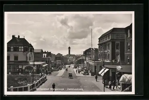 AK Wangerooge, Zedeliusstrasse mit Hotel Hanken und Blick auf Leuchtturm