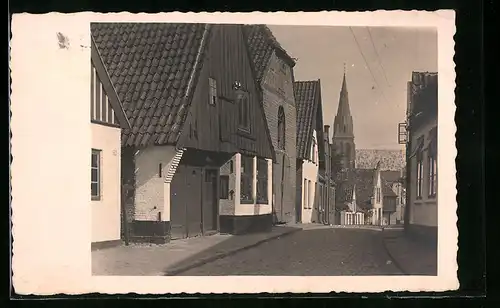 Foto-AK Meldorf, Strassenpartie mit Kirche 1931