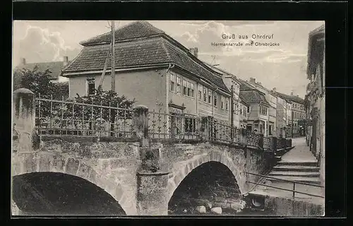 AK Ohrdruf, Hermannstrasse mit Geschäften und Ohrabrücke