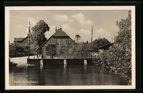 AK Kaköhl /Ostholstein, Ortsansicht vom Wasser aus