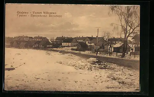 AK Grajewo, Vorort Wilczewo mit Landstrasse im Winter