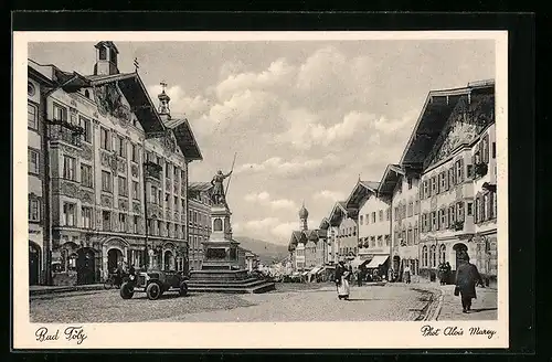 AK Bad Tölz, Strassenpartie mit Denkmal