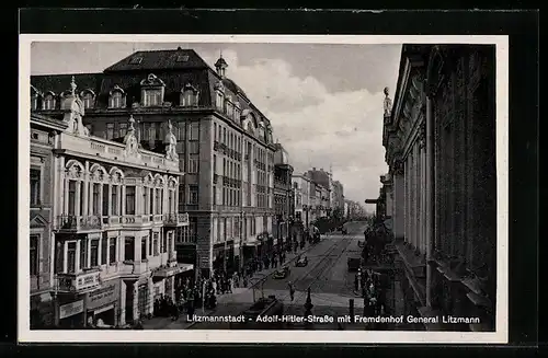 AK Litzmannstadt-Lodz, Strasse mit Fremdenhof General Litzmann und Strassenbahn