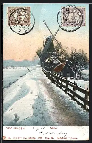 AK Groningen, Reitdiep, Ortspartie mit Windmühle im Schnee