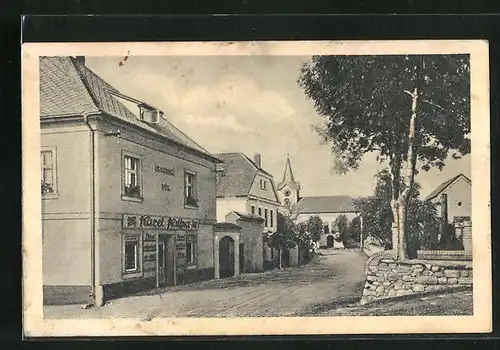 AK Trebotov, Strassenpartie mit Geschäft und Blick zur Kirche