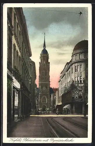 AK Krefeld, Rheinstrasse mit Dyonisiuskirche bei Dämmerung