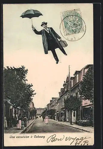 AK Cabourg, Fliegender Mann mit Hut und Schirm über einer Strasse