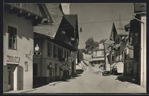 Foto-AK Mitterndorf, Strassenpartie mit Uhrmachergeschäft Kals, Treppenaufgang und Kirchturm