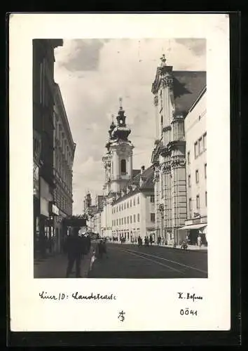 AK Linz a. D., Blick in die Landstrasse mit Kirche