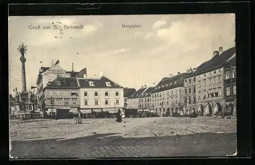 AK Wr. Neustadt, Hauptplatz mit Geschäften und Denkmal