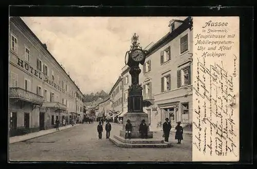 AK Bad Aussee / Salzkammergut, Hauptstrasse mit Hotel Alois Hackinger und Mobile-perpetum-Uhr