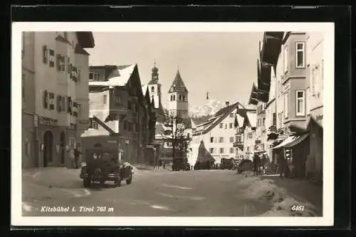 AK Kitzbühel, Strassenpartie mit Reisebüro und Geschäften