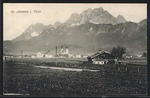 AK St. Johann i. Tirol, Ortsansicht aus der Ferne vor Bergen