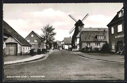 AK Augustfehn /Oldb., Mühlenstrasse mit Geschäften und Windmühle