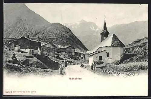 AK Tschamutt, Strassenpartie mit Kirche