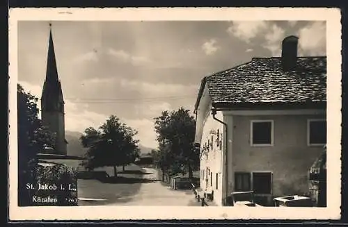 AK St. Jakob i. L., Ortspartie mit Blick zur Kirche