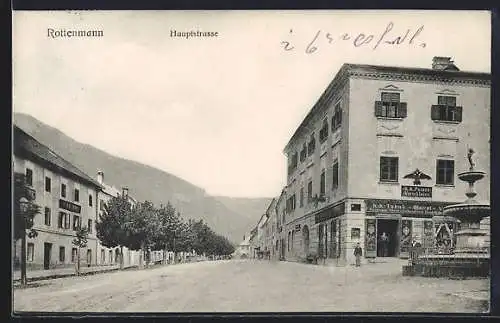 AK Rottenmann, Hauptstrasse mit Geschäft und Brunnen