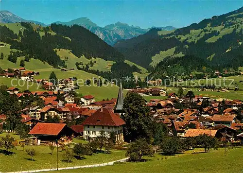 AK / Ansichtskarte Zweisimmen Ortsansicht mit Alpenpanorama Kat. Zweisimmen