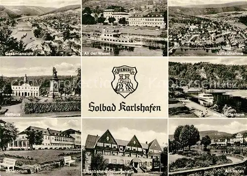 AK / Ansichtskarte Bad Karlshafen Gesamtansicht Weser Dampfer Luftaufnahme Hugenottenturm Rathaus Sanatorium Eisenbahn Erholungsheim Hafen Kat. Bad Karlshafen