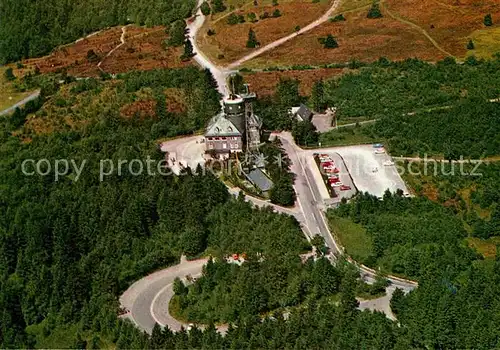 AK / Ansichtskarte Winterberg Hochsauerland Kahler Asten mit Astenturm Aussichtsturm Restaurant Wetterwarte Fliegeraufnahme Kat. Winterberg