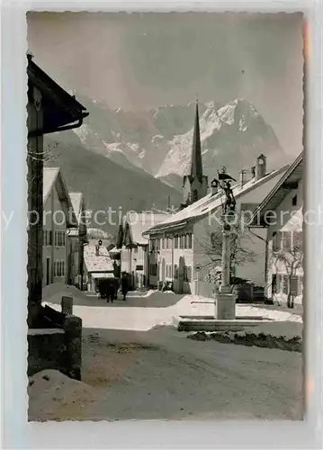 AK / Ansichtskarte Garmisch Partenkirchen Floriansbrunnen Winter Kat. Garmisch Partenkirchen