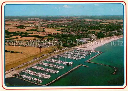 AK / Ansichtskarte Groemitz Ostseebad Hafen Strand Fliegeraufnahme Kat. Groemitz