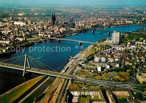 AK / Ansichtskarte Koeln Rhein Rheinblick mit Dom Severinsbruecke Deutzer Bruecke Hohenzollernbruecke Zoobruecke Fliegeraufnahme Kat. Koeln