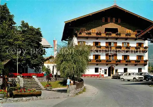 AK / Ansichtskarte Kirchberg Tirol Strassenmotiv Bechlwirt Dorfbrunnen Musikpavillon Kat. Kirchberg in Tirol