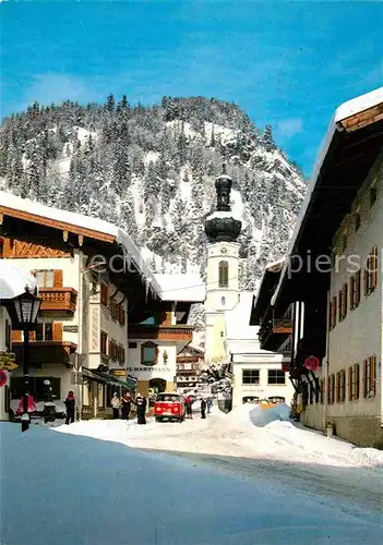 AK / Ansichtskarte Reit Winkl Dorfeinfahrt Blick zur Kirche im Winter Kat. Reit im Winkl