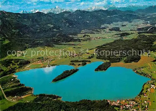 AK / Ansichtskarte Faakersee mit Karnischen Alpen Badeorte Egg Faak Sandbank Fliegeraufnahme Kat. Villach