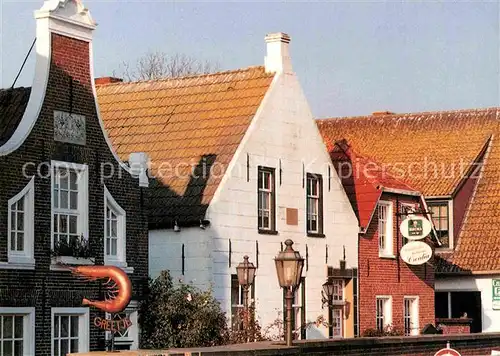 AK / Ansichtskarte Greetsiel Haeuserzeile Hafen Kat. Krummhoern