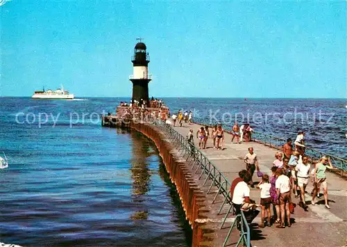 AK / Ansichtskarte Warnemuende Ostseebad An der Mole Leuchtturm Faehre Kat. Rostock