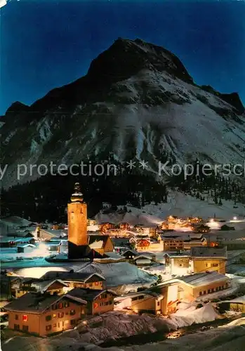 AK / Ansichtskarte Lech Vorarlberg Ortsansicht mit Kirche bei Nacht Blick gegen Omeshorn  Kat. Lech