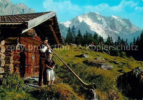 AK / Ansichtskarte Alphorn Alphornblaeser Sennenbb Wengen Jungfrau  Kat. Musik