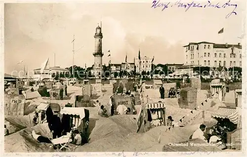 AK / Ansichtskarte Warnemuende Ostseebad Strandpartie Leuchtturm Kat. Rostock