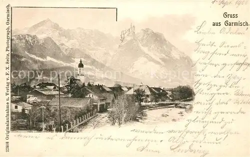 AK / Ansichtskarte Garmisch Partenkirchen Ortsansicht mit Kirche Alpenpanorama Kat. Garmisch Partenkirchen