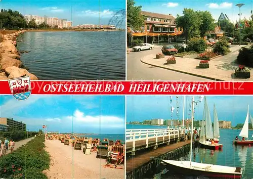 AK / Ansichtskarte Heiligenhafen Ostseebad Strand Promenade Steg Segelboote Kat. Heiligenhafen