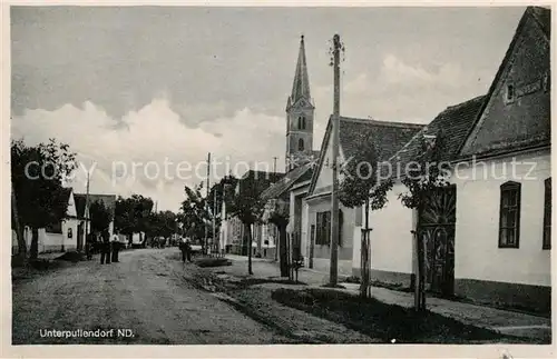 AK / Ansichtskarte Unterpullendorf Dorfstrasse Kirche