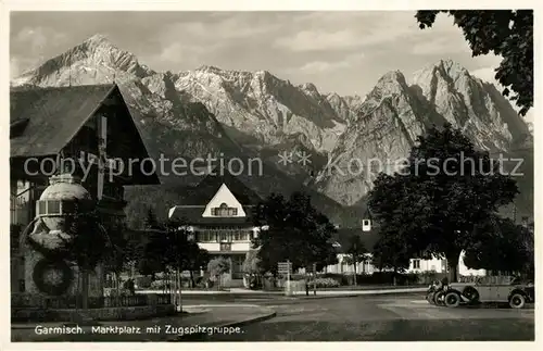 AK / Ansichtskarte Garmisch Partenkirchen Marktplatz mit Zugspitzgruppe Wettersteingebirge Kat. Garmisch Partenkirchen