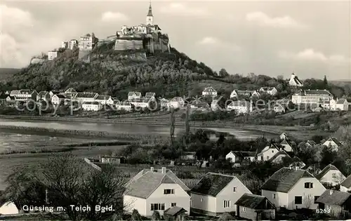 AK / Ansichtskarte Guessing Stadtbild mit Teich und Burg Kat. Guessing