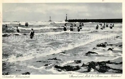 Warnemuende Ostseebad Strand und Mole bei Sturm Kat. Rostock