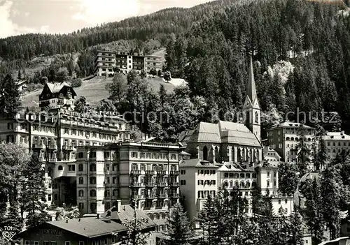 AK / Ansichtskarte Badgastein Kurhotel Kirche Weltkurort an der Tauernbahn Kat. Bad Gastein