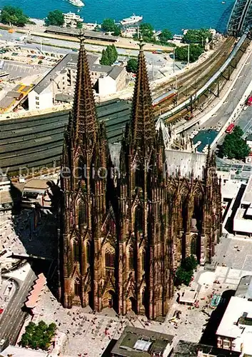 AK / Ansichtskarte Koeln Rhein Koelner Dom mit Blick zum Rheinufer Fliegeraufnahme Kat. Koeln