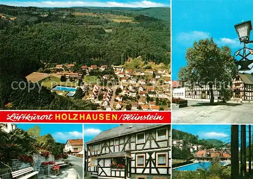 AK / Ansichtskarte Holzhausen_Huenstein Ortsmotive Fachwerkhaeuser Freibad Luftkurort Fliegeraufnahme Holzhausen_Huenstein