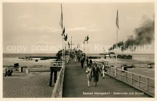 AK / Ansichtskarte Heringsdorf_Ostseebad_Usedom Seebruecke und Strand Heringsdorf_Ostseebad